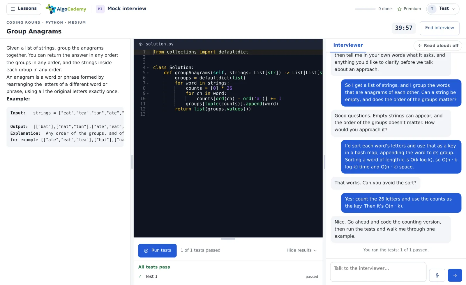 A coding round in the AlgoCademy mock interview room: the Group Anagrams problem on the left, the candidate’s Python code in the editor with all tests passing, and the conversation with the interviewer on the right.